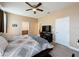 Spacious bedroom with ceiling fan, carpeting, and connecting bathroom at 3193 Crispin Cir, Harmony, FL 34773