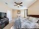 Spacious bedroom with ceiling fan, carpeting, and TV on media console at 3193 Crispin Cir, Harmony, FL 34773
