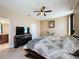 Spacious bedroom with ceiling fan, carpeting, and TV on media console at 3193 Crispin Cir, Harmony, FL 34773