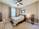 Inviting bedroom with soft carpet, neutral decor, and a window providing natural light, creating a peaceful ambiance at 3193 Crispin Cir, Harmony, FL 34773
