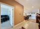 Hallway view showcasing the home's open floor plan connecting living spaces at 3193 Crispin Cir, Harmony, FL 34773