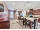 Spacious kitchen featuring a central island, tile flooring, and modern appliances at 3193 Crispin Cir, Harmony, FL 34773