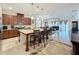 Open-concept kitchen with center island, stainless steel appliances, and seamless flow to the living area at 3193 Crispin Cir, Harmony, FL 34773