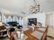 Open living space features a dining area and comfortable seating with ample natural light at 3193 Crispin Cir, Harmony, FL 34773