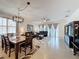 Combined living and dining area with large windows and comfortable seating, filled with natural light at 3193 Crispin Cir, Harmony, FL 34773