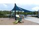 Playground with slide, climbing apparatus and sunshade near community pool at 3193 Crispin Cir, Harmony, FL 34773