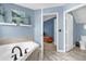 Bright bathroom with a soaking tub and dark fixtures; perfect for relaxation at 3214 Herons Point Cir, Kissimmee, FL 34741