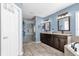 Stylish bathroom with double vanity, soaking tub and large glass shower at 3214 Herons Point Cir, Kissimmee, FL 34741