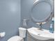 Cozy bathroom features a modern sink, large decorative mirror and neutral paint at 3214 Herons Point Cir, Kissimmee, FL 34741