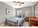 Well-lit bedroom with a comfortable bed, wooden furnishings, and window at 3214 Herons Point Cir, Kissimmee, FL 34741