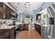 Spacious kitchen with stainless steel appliances, tile backsplash, and dark cabinets is ready for entertaining at 3214 Herons Point Cir, Kissimmee, FL 34741