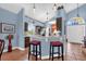 Kitchen features an eat-in bar with barstools and views to the front door and home office at 3214 Herons Point Cir, Kissimmee, FL 34741