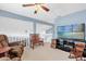 Open loft area overlooking the living room, complete with cozy seating and media setup at 3214 Herons Point Cir, Kissimmee, FL 34741