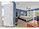 Comfortable main bedroom with a king bed, ceiling fan and an ensuite bathroom at 3214 Herons Point Cir, Kissimmee, FL 34741