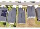 This aerial view displays the layout of the houses within the neighborhood and their proximity to one another at 328 Lily Ln, Davenport, FL 33837