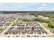 This is an aerial view of the residence in relation to the clubhouse, pool, and the surrounding neighborhood at 328 Lily Ln, Davenport, FL 33837