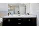 Modern bathroom with double vanity, large mirror, and walk-in shower at 328 Lily Ln, Davenport, FL 33837
