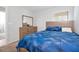 Comfortable bedroom with bed, dresser, and natural light at 328 Lily Ln, Davenport, FL 33837