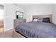 Well-lit bedroom features a bed with neutral-colored pillows and matching night stand at 328 Lily Ln, Davenport, FL 33837
