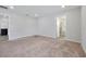 Large bedroom with neutral walls, carpet, and ensuite bathroom at 328 Lily Ln, Davenport, FL 33837