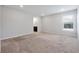 Spacious bedroom with neutral walls, carpet flooring, and natural light at 328 Lily Ln, Davenport, FL 33837