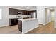 Modern kitchen with a center island and stainless steel appliances at 328 Lily Ln, Davenport, FL 33837