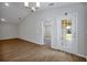 Open living room with wood floors, neutral walls, and natural light at 328 Lily Ln, Davenport, FL 33837