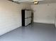 Clean garage featuring durable epoxy flooring and storage, ideal for organization at 359 Arbor Lakes Dr, Davenport, FL 33896