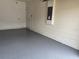 Functional garage space offering epoxy flooring and convenient access to interior at 359 Arbor Lakes Dr, Davenport, FL 33896