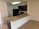 Efficient kitchen featuring stainless steel appliances, granite countertops, and dark cabinets at 359 Arbor Lakes Dr, Davenport, FL 33896