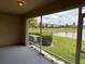 Relaxing screened lanai with views of a tranquil pond and manicured landscaping at 359 Arbor Lakes Dr, Davenport, FL 33896