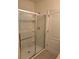 Modern bathroom shower with glass enclosure, updated fixtures, and neutral design at 359 Arbor Lakes Dr, Davenport, FL 33896