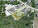 Aerial shot emphasizing the property's positioning, with lush greenery surrounding the residential area at 41 Orchid Ct, Kissimmee, FL 34759