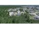 Aerial view showcasing the property's location within a serene, wooded neighborhood at 41 Orchid Ct, Kissimmee, FL 34759