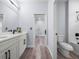 Bright bathroom with a double vanity, a toilet, and a bath tub and shower combo at 41 Orchid Ct, Kissimmee, FL 34759