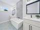 New bathroom featuring patterned tile flooring, soaking tub, and modern vanity at 41 Orchid Ct, Kissimmee, FL 34759