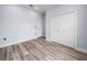 Bedroom with wood-look floors and double door closet at 41 Orchid Ct, Kissimmee, FL 34759