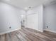 Bedroom featuring wood-look floors, closet, and an ensuite bathroom at 41 Orchid Ct, Kissimmee, FL 34759