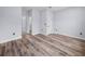 Spacious bedroom with wood flooring and a view of an additional room at 41 Orchid Ct, Kissimmee, FL 34759