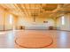 Spacious gymnasium featuring basketball court, high ceilings, and ample natural light for recreational activities at 41 Orchid Ct, Kissimmee, FL 34759