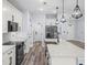 Open kitchen featuring modern appliances, bright countertops and wood flooring at 41 Orchid Ct, Kissimmee, FL 34759