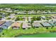 Lakeside homes featuring screened lanais, well manicured lawns, and lovely green foliage at 4244 Windchime Ln, Lakeland, FL 33811
