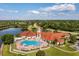 Aerial view of the community pool, clubhouse, and amenities at 4244 Windchime Ln, Lakeland, FL 33811