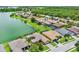 Aerial view of home showcasing serene lake and surrounding community at 4244 Windchime Ln, Lakeland, FL 33811