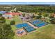 Aerial view of the community showing various athletic courts at 4244 Windchime Ln, Lakeland, FL 33811