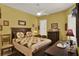 Cozy bedroom features a ceiling fan, window blinds, and vintage furniture at 4244 Windchime Ln, Lakeland, FL 33811