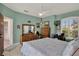 This is a cozy bedroom with an attached outdoor patio and a view of the trees at 4244 Windchime Ln, Lakeland, FL 33811