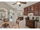 Dining area with wood table and chairs, china cabinet, tiled flooring, and butler's pantry at 4244 Windchime Ln, Lakeland, FL 33811