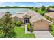 Charming single-Gathering home with a well-manicured lawn and scenic lake view at 4244 Windchime Ln, Lakeland, FL 33811