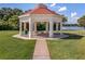 Community gazebo provides a pleasant gathering space with lake views and picnic tables at 4244 Windchime Ln, Lakeland, FL 33811